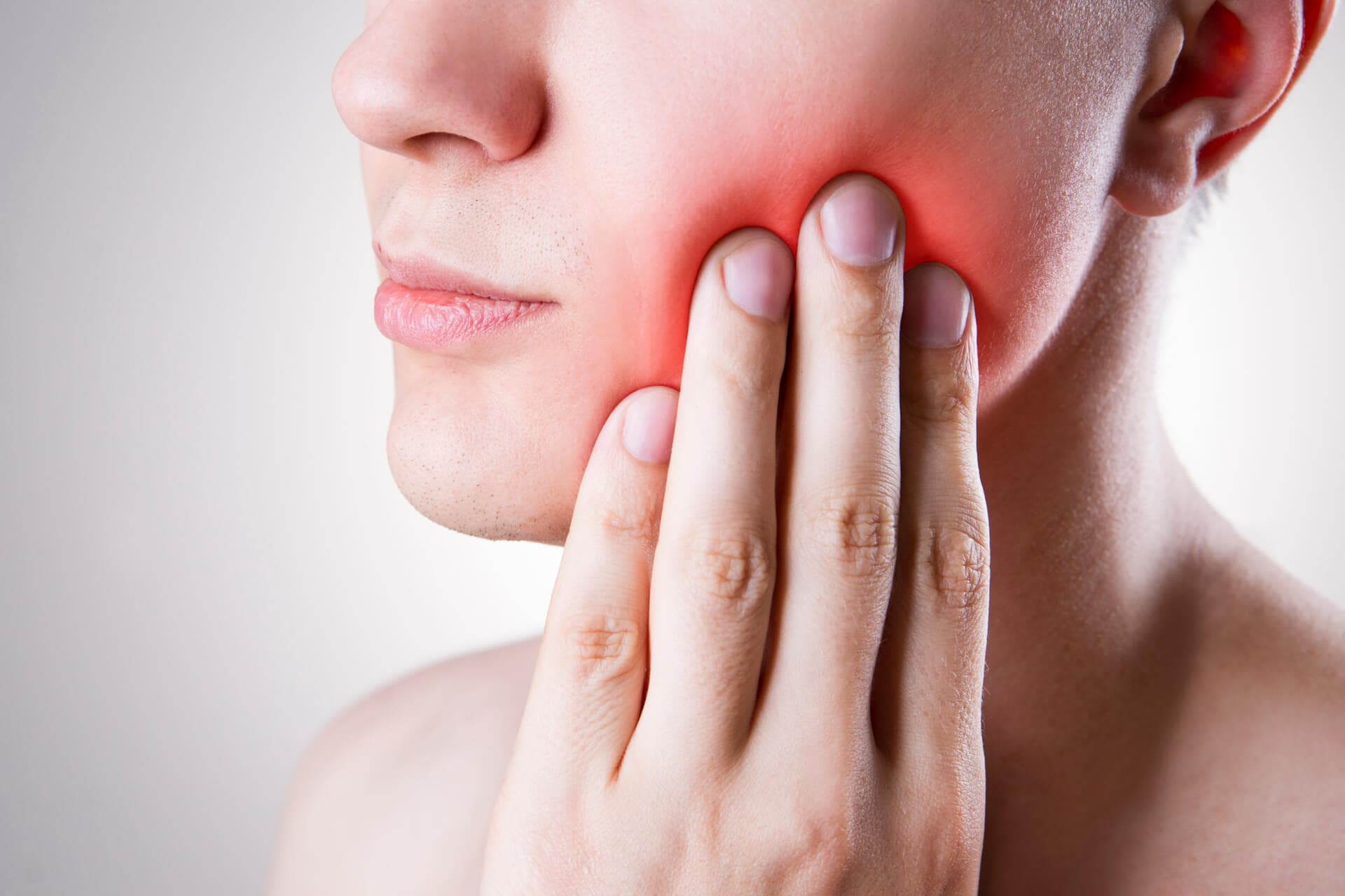 a woman holding on to her painful gum