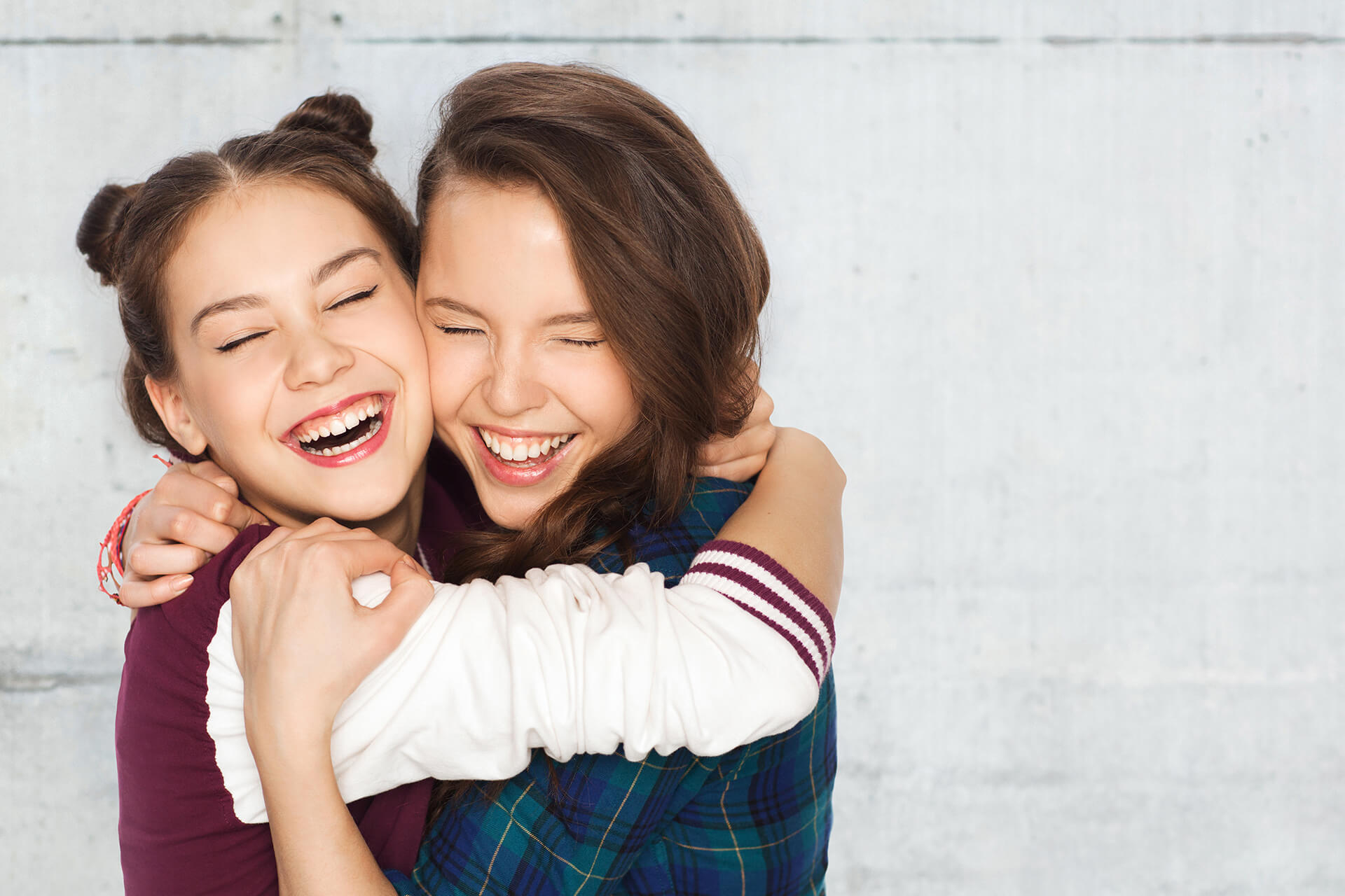 young ladies smiling with Clear Braces