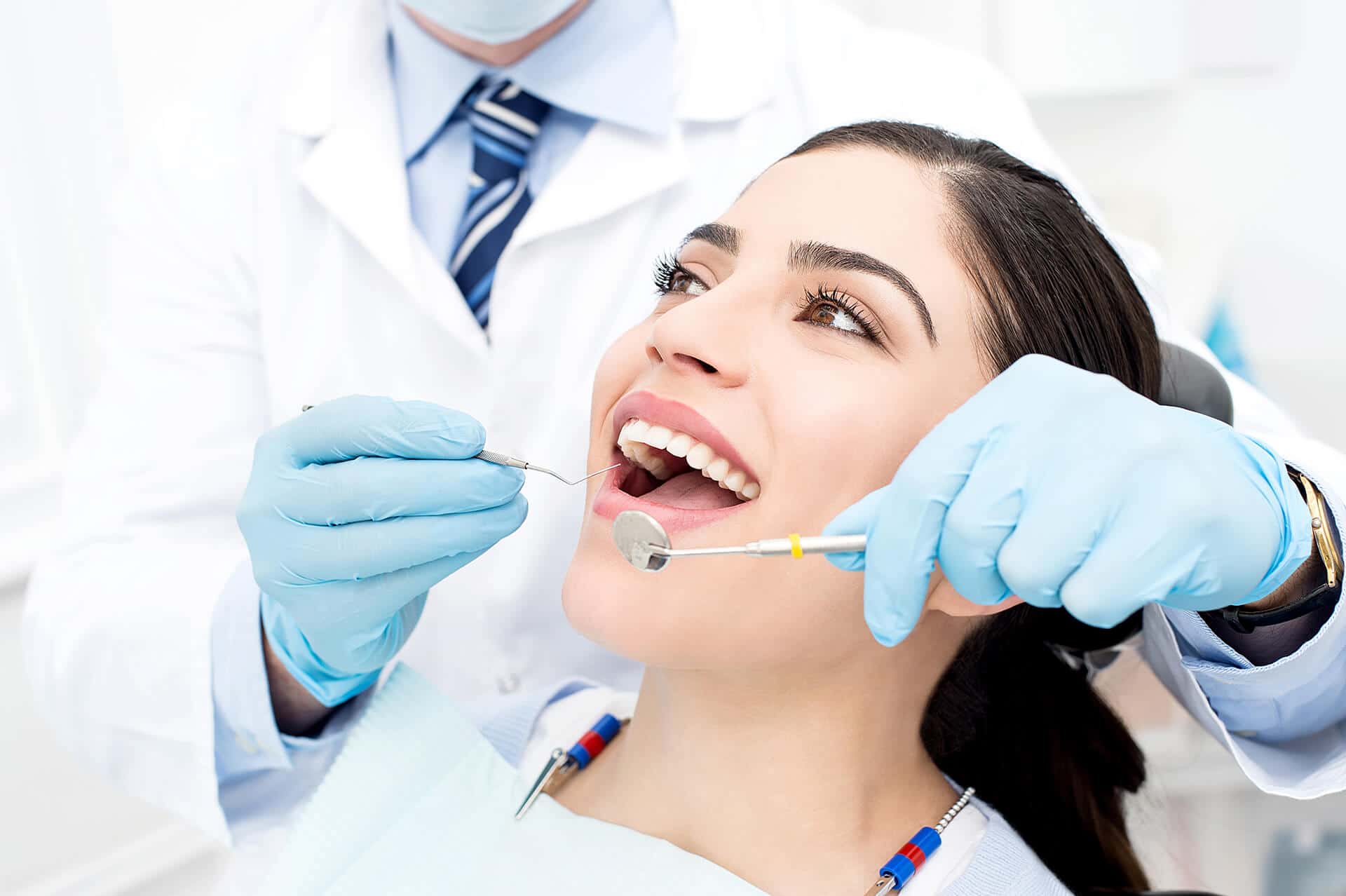 a dentist checking a patient's teeth condition